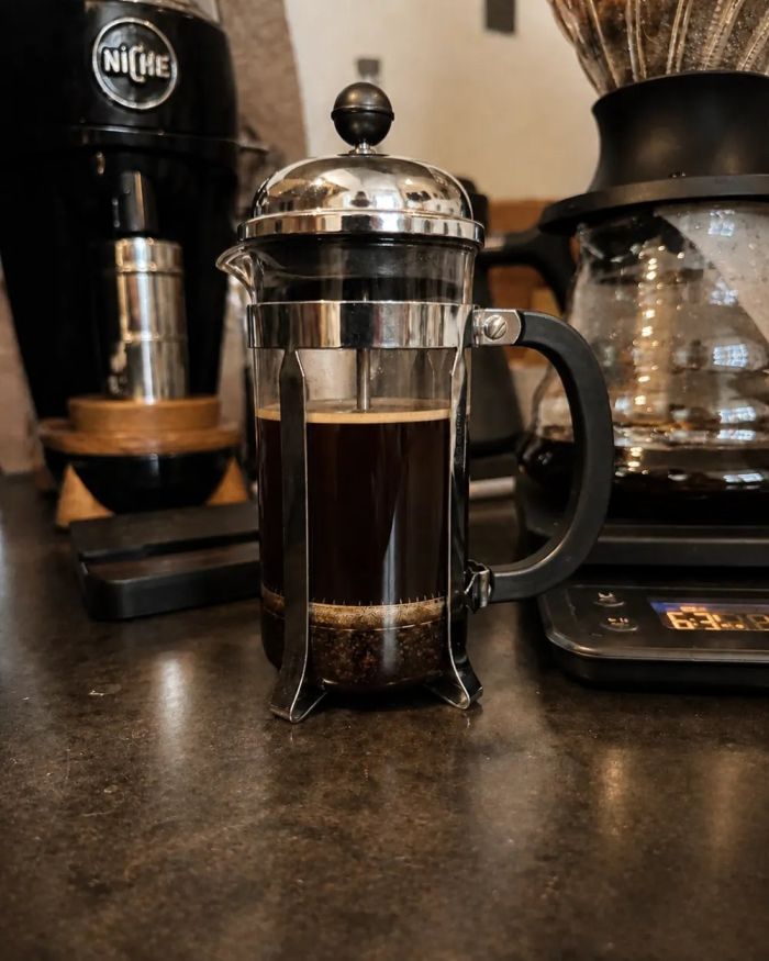 A French press full of coffee